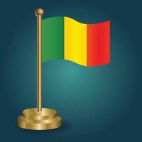 Mali national flag on golden pole on gradation isolated dark background. table flag, vector illustration