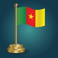 Cameroon national flag on golden pole on gradation isolated dark background. table flag, vector illustration