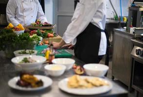 team cooks and chefs preparing meal photo