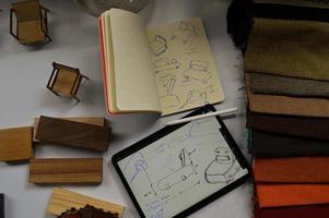 furniture design, digital drawing in tablet and analog in notebook photo