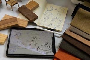 furniture design, digital drawing in tablet and analog in notebook photo