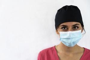 young female dentist holding dental instruments in her hand photo