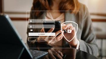 Cyber security concept, Login, User, identification information security and encryption, secure access to user's personal information woman using smart phone and tablet in office photo