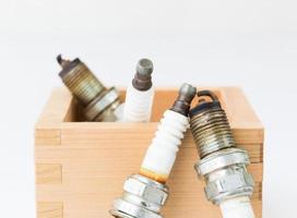 Spark plug in wood box photo