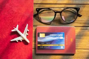 Credit card put on passport on wooden desk photo