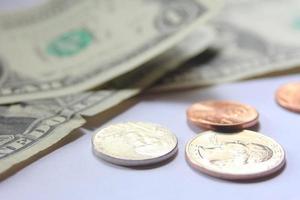 dollar bills and coins Spread them on a white background. photo