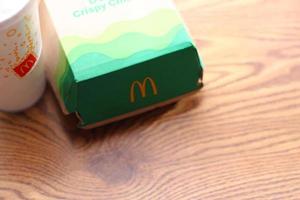 Washington  America June 17 2022  McDonald's deluxe Crispy Chicken Burger Box made from recycled paper with a glass of Pepsi. photo