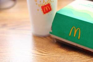 Washington  America June 17 2022  McDonald's deluxe Crispy Chicken Burger Box made from recycled paper with a glass of Pepsi. photo