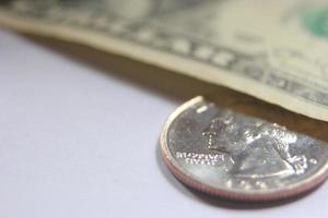 dollar bills and coins Spread them on a white background. photo