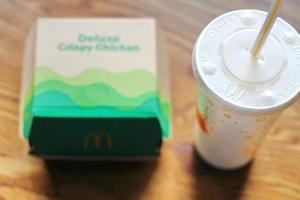 Washington  America June 17 2022  McDonald's deluxe Crispy Chicken Burger Box made from recycled paper with a glass of Pepsi. photo