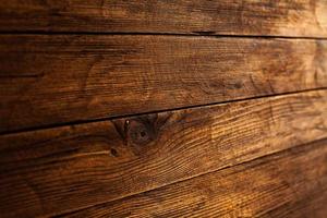 Vintage colored wood background texture with knots and nail holes. Old painted wood wall. Wooden dark horizontal boards. Front view with copy space. photo