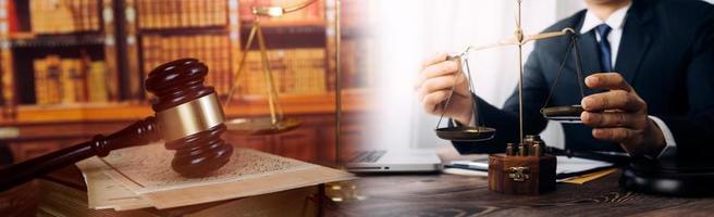 Business and lawyers discussing contract papers with brass scale on desk in office. Law, legal services, advice, justice and law concept picture with film grain effect photo