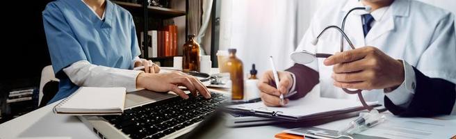Medicine doctor and stethoscope touching icon medical network connection with modern interface on digital tablet in hospital background. Medical technology network concept photo