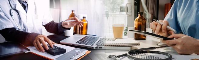 Medicine doctor and stethoscope touching icon medical network connection with modern interface on digital tablet in hospital background. Medical technology network concept photo