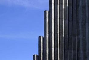 Concrete pillars against a blue sky photo