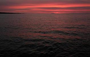 Intense sunset at the coast of Reykjavik, Iceland photo