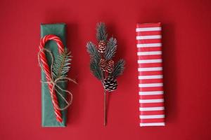 Christmas presents or gifts lying on a red background ready for celebration photo