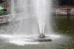 Fountain in the complex of Lodhi Garden in Delhi India, working fountain in the Lodhi Garden complex, water in the fountain, fountain in the Lodhi Garden park during morning time photo