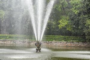 Fountain in the complex of Lodhi Garden in Delhi India, working fountain in the Lodhi Garden complex, water in the fountain, fountain in the Lodhi Garden park during morning time photo