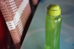 photo of light green beverage container bottle