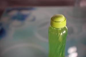 photo of light green beverage container bottle