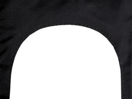 Black synthetic fabric archway with seam isolated on white photo