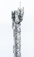 Telecommunication tower on white background photo