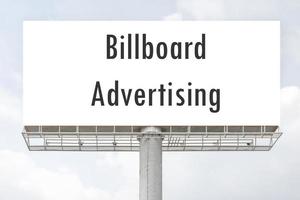 Outdoor pole billboard with mock up white screen on blue sky background with clipping path photo