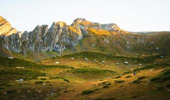 Hiker in mountains solo travel photo