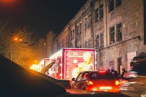 Tbilisi, Georgia,2021- Coca cola xmas festive decorated trucks caravan tour in city Tbilisi streets photo