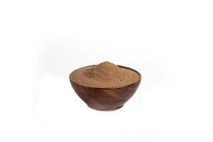 black ground pepper powder on a white background. photo