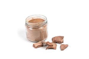 Dry arjun chal powder or Terminalia arjuna ayurvedic herb on white background photo