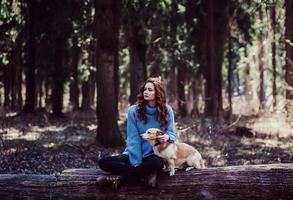 girl sitting with a dog photo