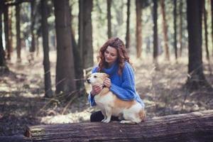 woman with her little dog park outdoors. photo