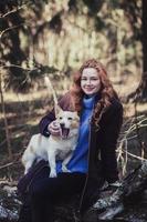 girl with dog in park photo