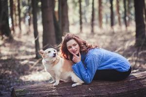 woman playing with her dog photo