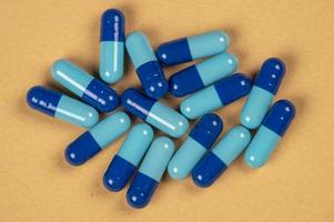 pill capsules and two shades of blue