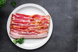 bacon strips pork lard meat meal food snack on the table copy space food background photo