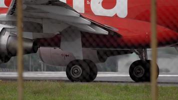 Close up, detail shot of a modern jet engine as the aircraft taxis along. The landing gear and fuselage are also visible video