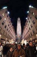 NEW YORK, USA - DECEMBER 9, 2011 - People at rockfeller center celebrating xmas photo