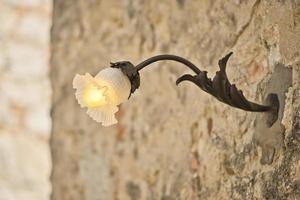 street lamp in medieval italian village photo