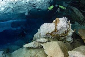 halocline effect while diving in cenotes cave in Mexico photo