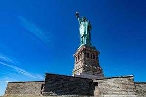 Statue of liberty in New York on blue sky photo