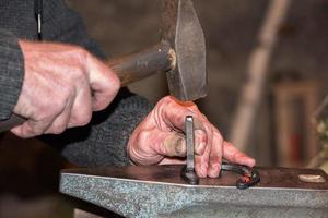 old retired man hands working photo