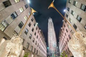 NEW YORK, USA - DECEMBER 9, 2011 - People at rockfeller center celebrating xmas photo