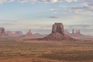 Monument Valley view on cloudy sky background photo