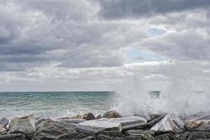 sea in tempest on rocks photo