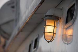 ship lantern after sunset detail photo