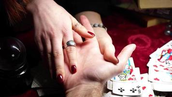 Mystic girls reading cards and palms, future telling video