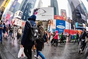 NEW YORK - USA  APRIL 22 2017 times square moving people in rainy day photo